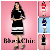 Woman wearing a black and white dress with 'BlockChic' branding on a pink background.