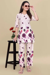 Woman wearing a floral outfit on a beige background