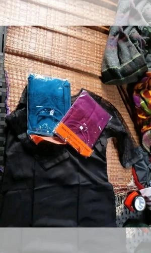 Colorful towels on a wooden surface with a blurred background