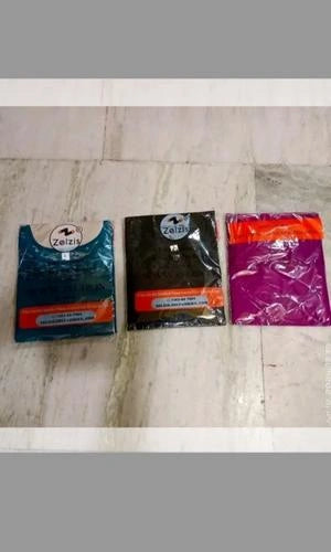 Three packages of Zelzis products on a tiled floor.