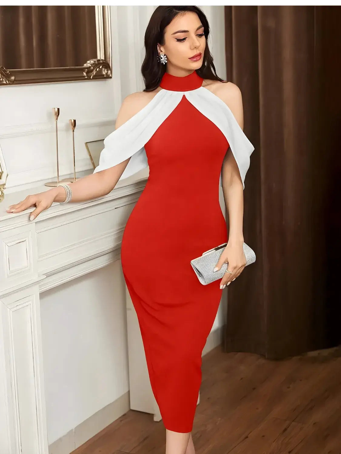Woman in a red and white dress standing in a room with a fireplace.