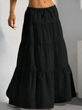 Black tiered maxi skirt on a plain background