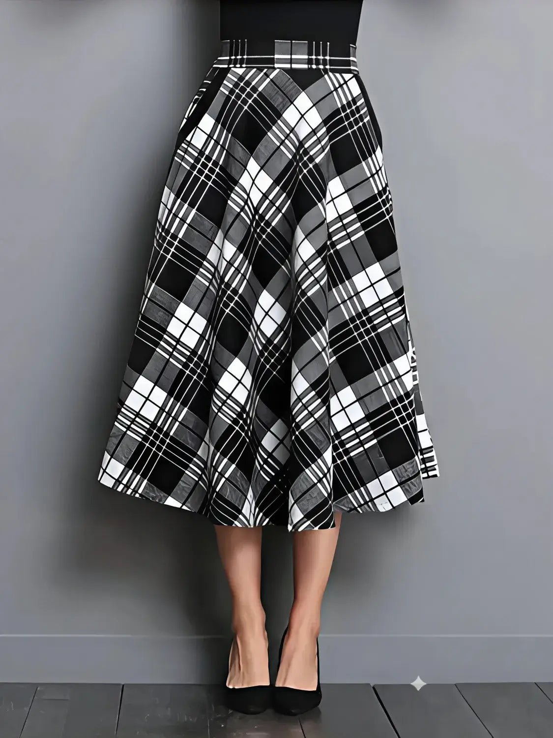 Black and white plaid skirt on a plain background