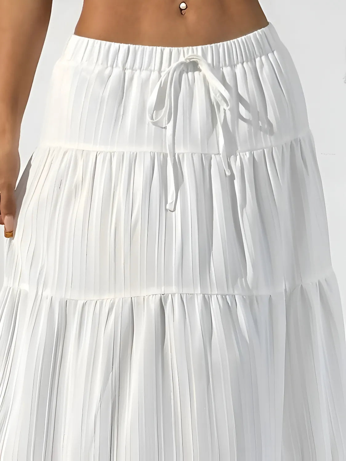 White tiered skirt with a drawstring waist on a white background