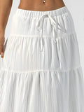 White tiered skirt with a drawstring waist on a white background