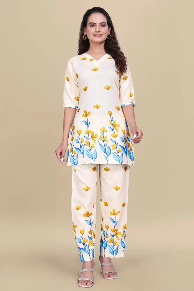 Woman wearing a floral printed outfit on a beige background