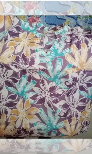 Floral patterned fabric with purple, yellow, and blue colors.