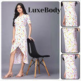 Woman wearing a colorful dress with 'LuxeBody' branding, sitting on a black chair.