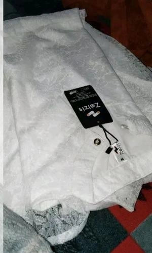 Gray garment with a brand tag on a checkered floor