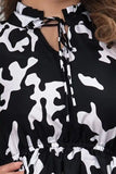 comfortable black floral tunic with ruffle neck for parties
