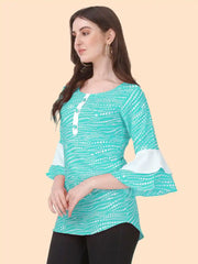 elegant light green crepe top with playful polka dot design
