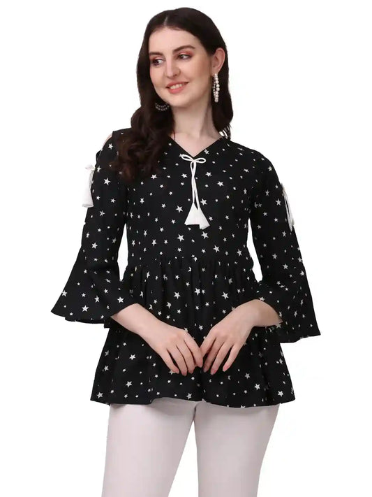 stylish black tunic with star print and fancy cutout design
